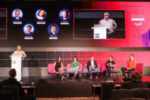 David on stage moderating the closing session
