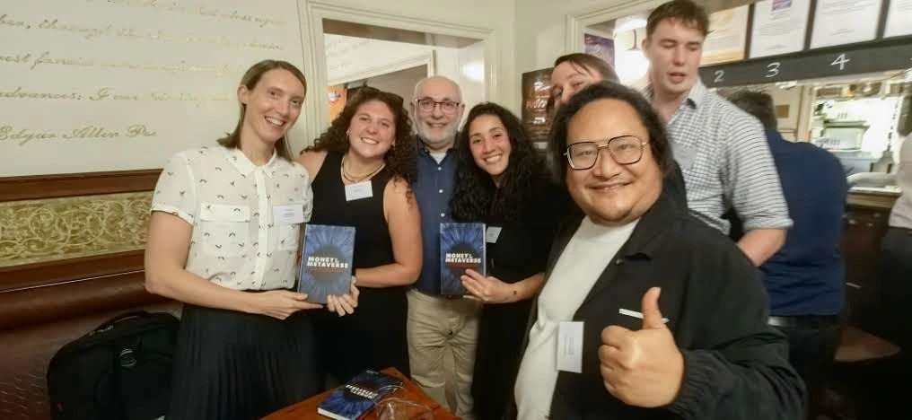 Payments Pub Quiz Winners The AMEX Blues holding their prize copies of David's latest book