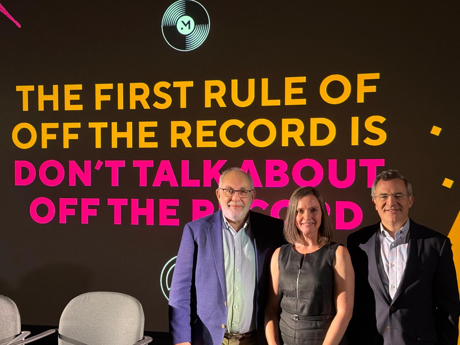 David Birch, Kirsty Rutter and Matt Harris standing in front of screen which says 'The first rule of off the record is don't talk about off the record' for their session The Real Disruption in Retail Financial Services – customers getting AI!