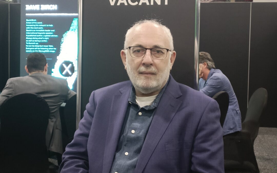 David Birch sat in front of wall which says Vacant!