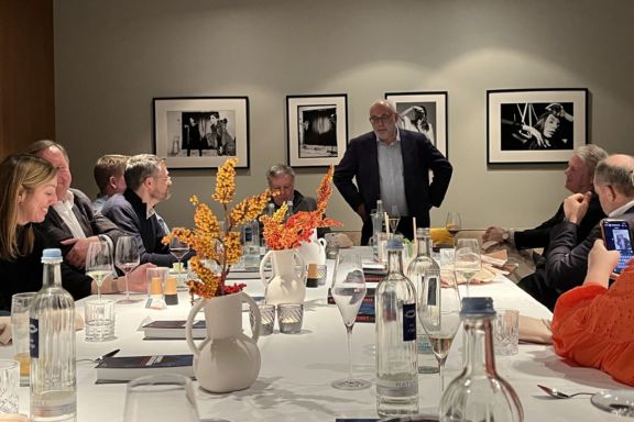 David giving a talk at dinner. 
