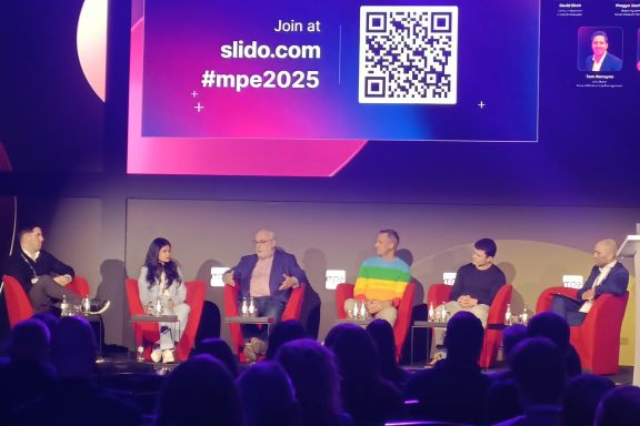 Panellist - Embedded Payments session, David sat amongst his  fellow panellists on stage