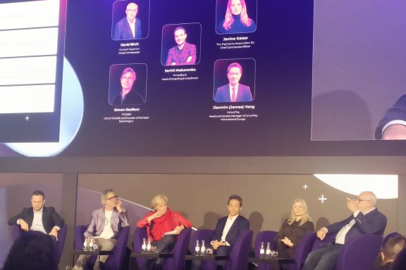 David on stage with fellow panellists discussing innovation in the world of payments