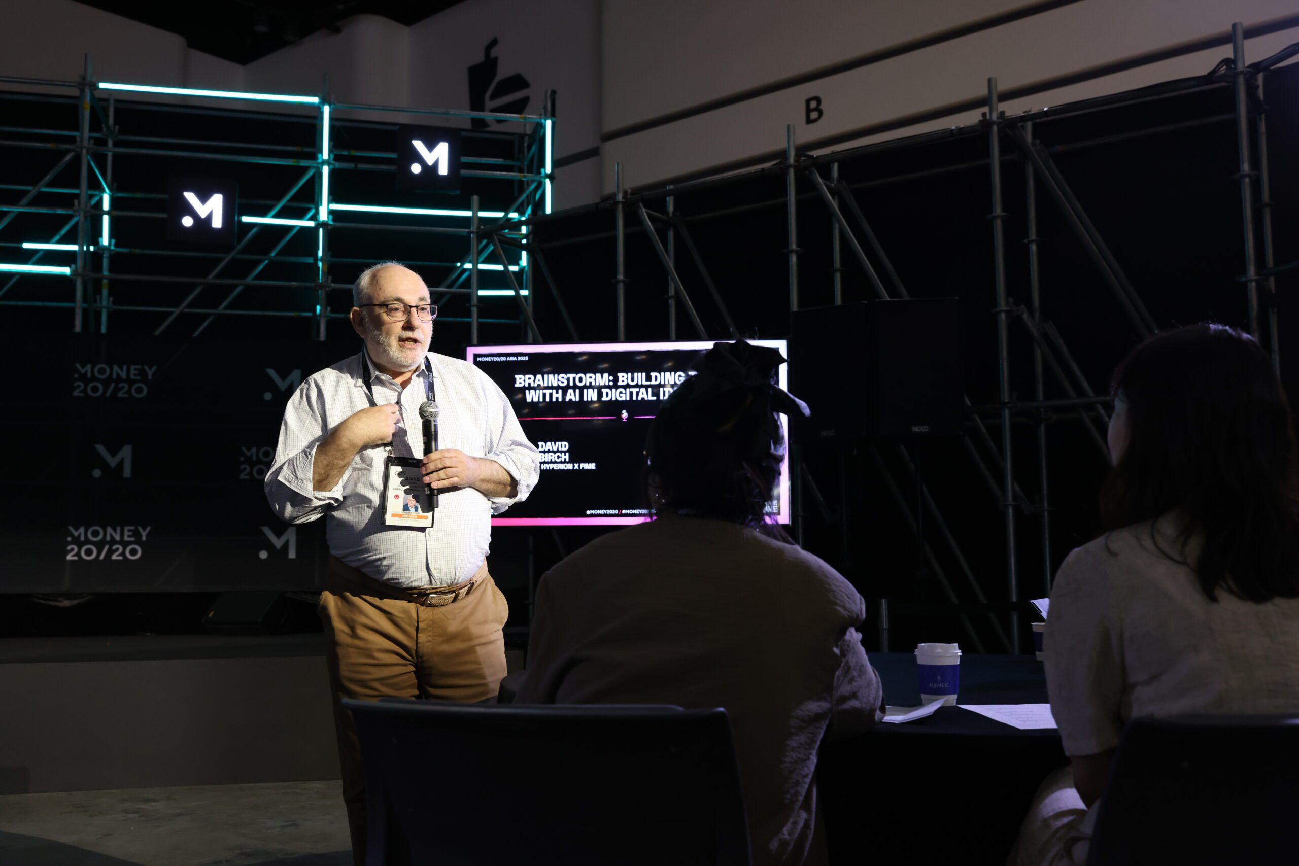 AI in Payments: David Birch walking the room delivering the Building Trust in digital identity session 