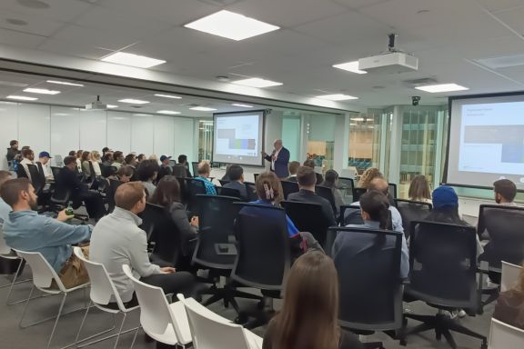 David Birch delivering a keynote to a crowd of employees before a stablecoins scenario planning workshop in Canada